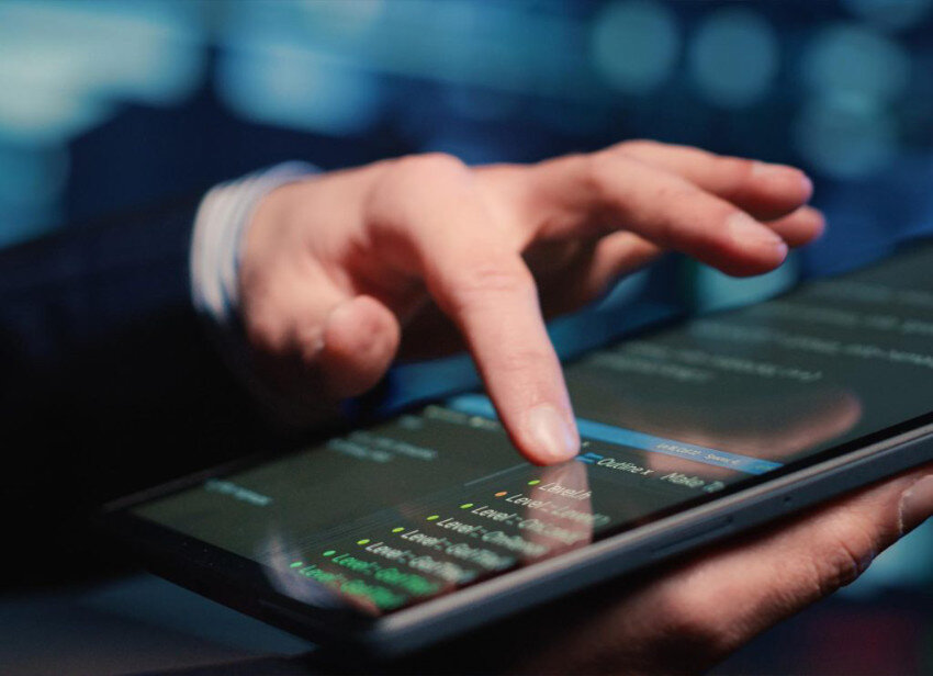 Man hands using tablet that has data information.